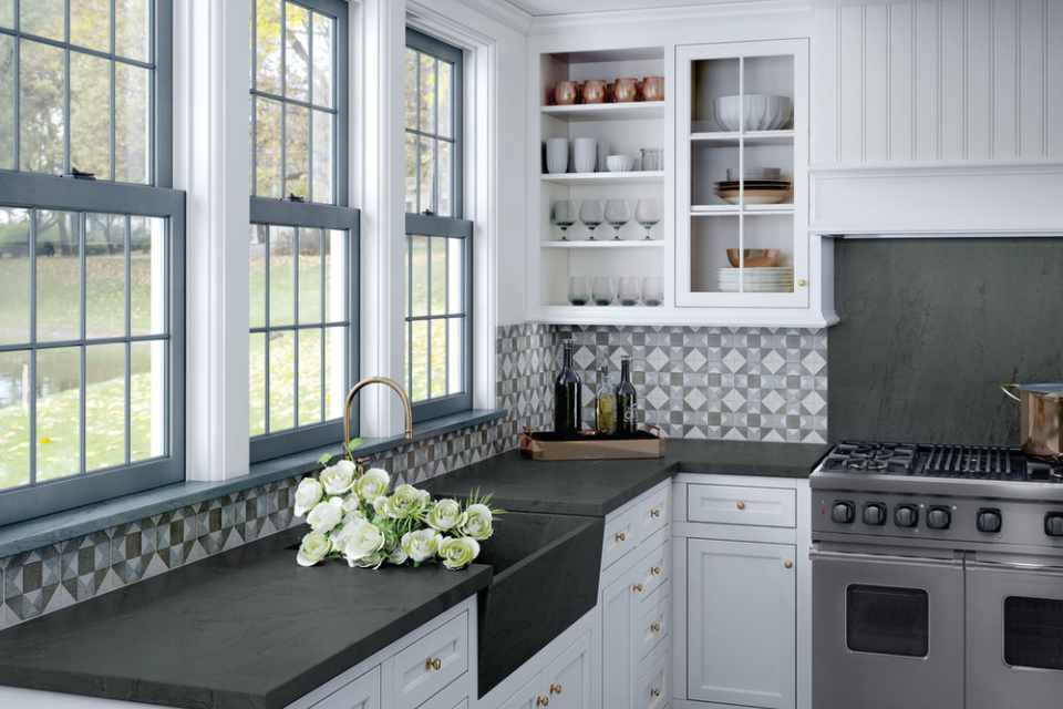 blue and grey geometric tile backsplash in kitchen